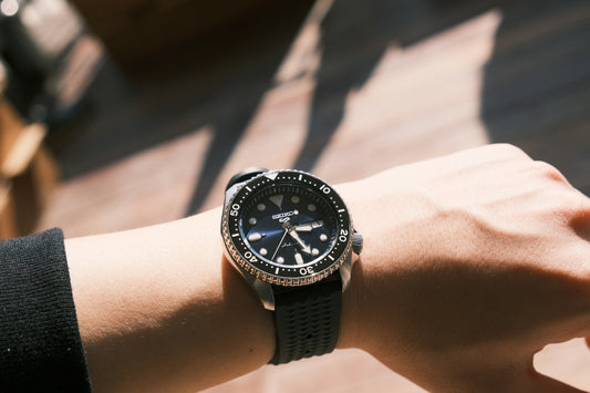 a person wearing a watch on their wrist