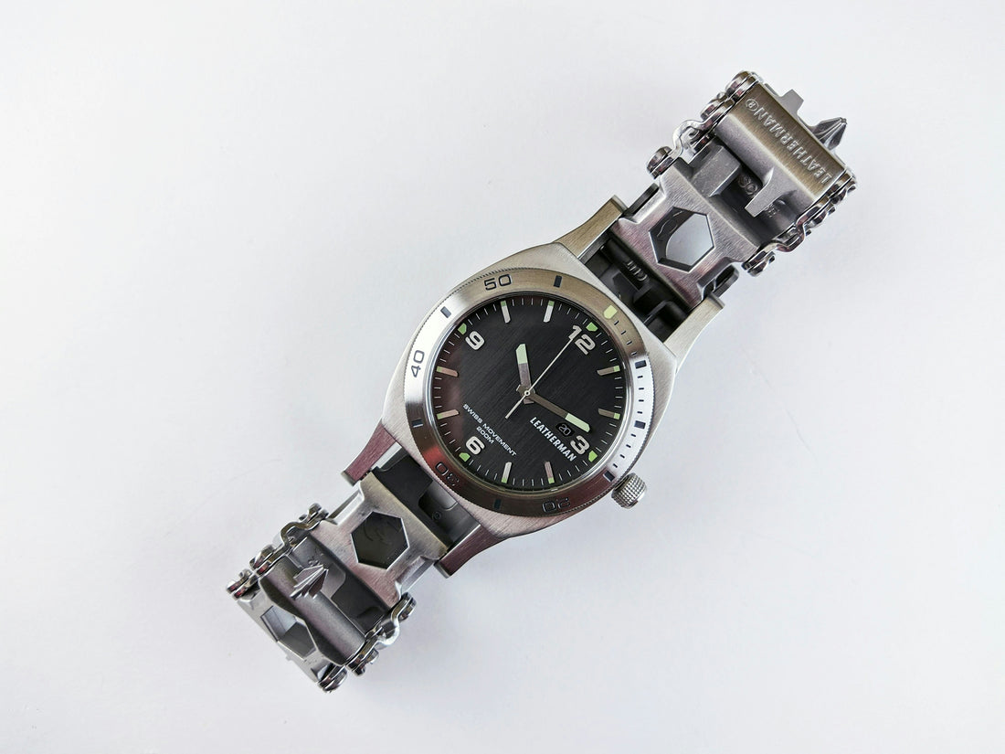 a watch that is sitting on a white surface