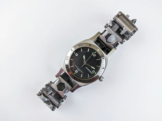 a watch that is sitting on a white surface