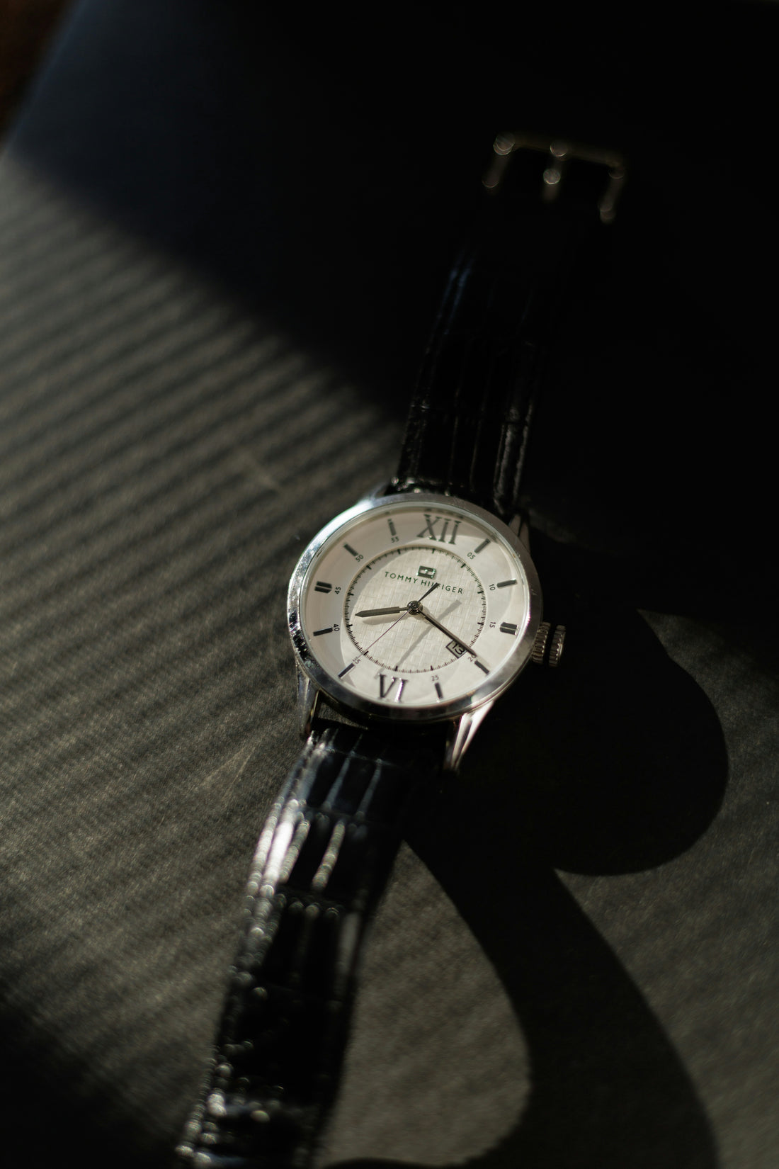 Classic wristwatch with roman numerals on strap