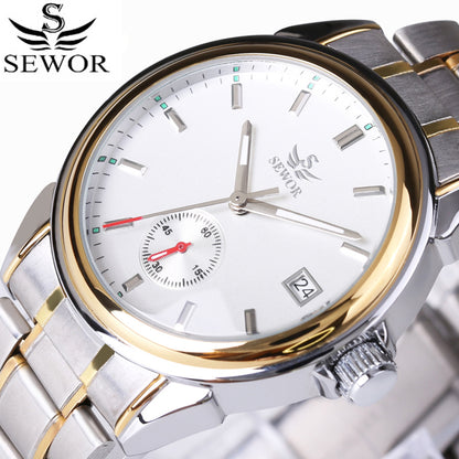 Silver and gold SEWOR watch with a white dial on a blurred background