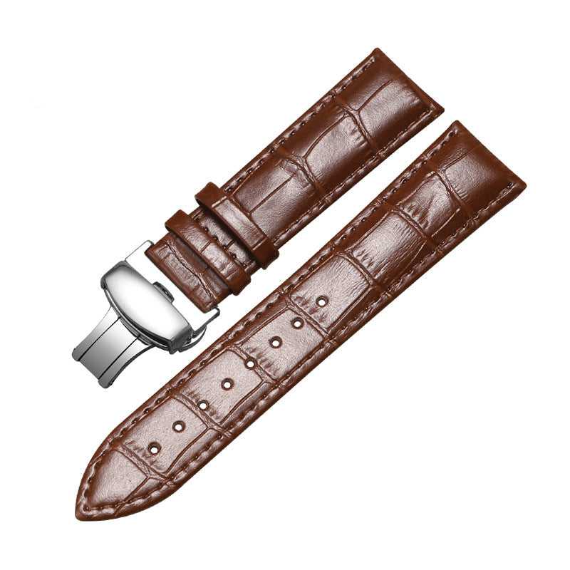 Brown leather watch strap with silver buckle on a white background
